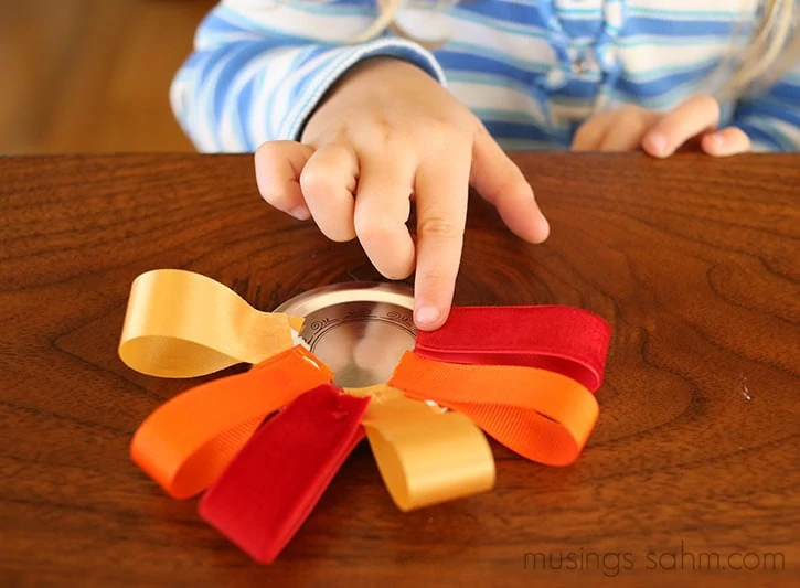 This adorable Canning Jar Lid Turkey Magnet is a fun easy Thanksgiving craft for kids that they'll love putting together and you'll love displaying! They also make great gifts!