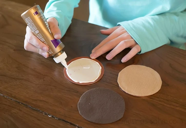 Glue felt circles for faces