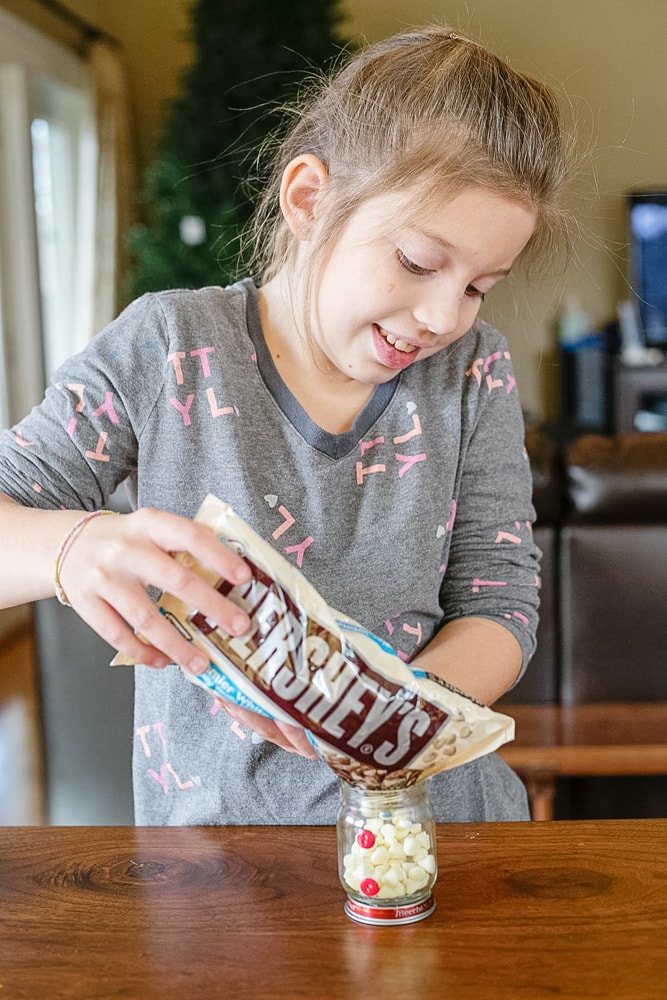 A homemade gift idea that doubles as a fun craft for kids, this DIY Hot Cocoa Snowman is adorable and easy to make too!