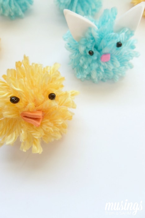 DIY Pom Pom Chicks and Bunnies with an upcycled wipes bin as storage & a fun Tic Tac Toe game board!