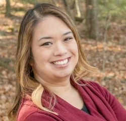 A woman smiling for the camera