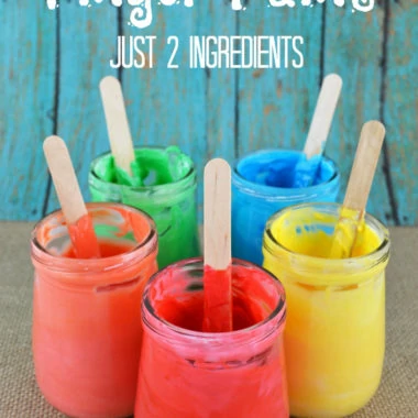 jars with colorful homemade edible finger paint and popsicle sticks