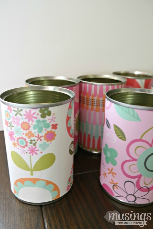 This Decorated Tin Can Organizer for Kids is perfect for storing scissors, pens, markers, glue sticks and so much more. Easy and inexpensive, this DIY project is cute enough to display on a desk or craft table. Adults will love it too!