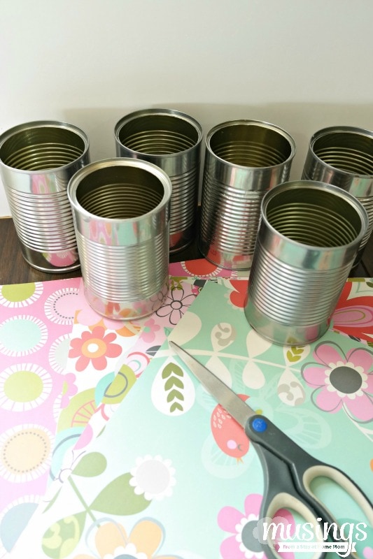 This Decorated Tin Can Organizer for Kids is perfect for storing scissors, pens, markers, glue sticks and so much more. Easy and inexpensive, this DIY project is cute enough to display on a desk or craft table. Adults will love it too!