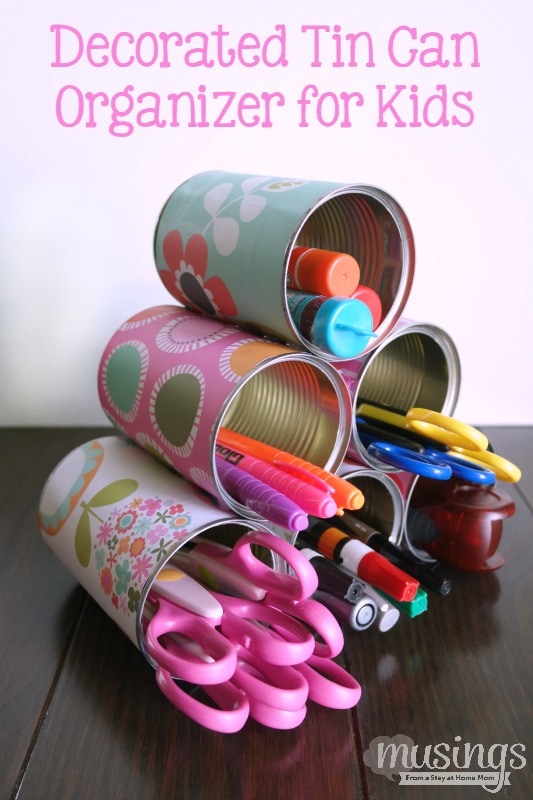 This Decorated Tin Can Organizer for Kids is perfect for storing scissors, pens, markers, glue sticks and so much more. Easy and inexpensive, this DIY project is cute enough to display on a desk or craft table. Adults will love it too!