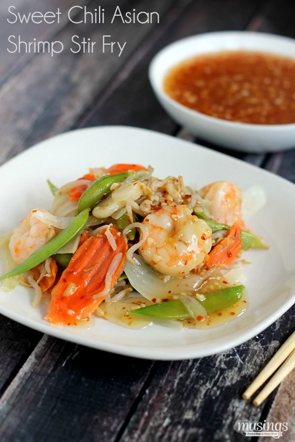 Treat yourself to this tasty Sweet Chili Asian Shrimp Stir Fry recipe for a quick and easy, healthy dinner. You'll love the flavorful honey sauce (there's no sugar!) combined with vegetables and shrimp. Yum!