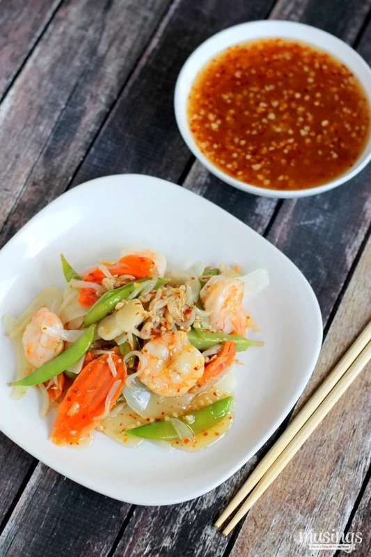 Treat yourself to this tasty Sweet Chili Asian Shrimp Stir Fry recipe for a quick and easy, healthy dinner. You'll love the flavorful honey sauce (there's no sugar!) combined with vegetables and shrimp. Yum!