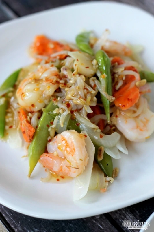 Treat yourself to this tasty Sweet Chili Asian Shrimp Stir Fry recipe for a quick and easy, healthy dinner. You'll love the flavorful honey sauce (there's no sugar!) combined with vegetables and shrimp. Yum!