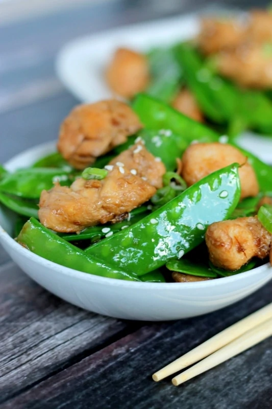 This tasty recipe for Ginger Chicken and Snowpeas is easy to make and ready in less than 20 minutes - a delicious dinner after a busy day!