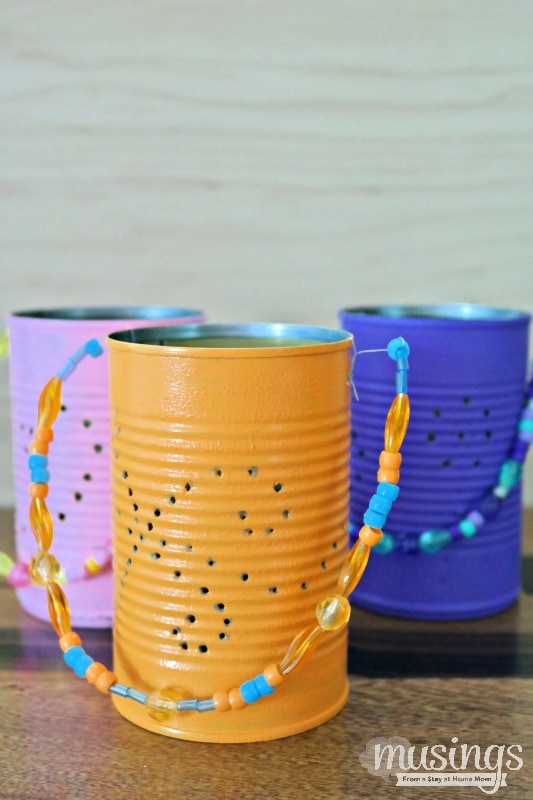 DIY Tin Lanterns are a fun, inexpensive way to recycle and add delightful decoration to your backyard on warm summer nights!