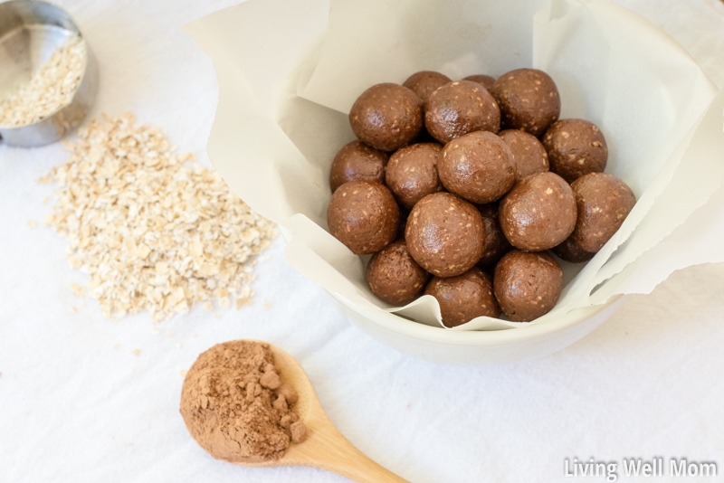 Gluten-free chocolate balls rolled uniformly and placed in a lined bowl. 