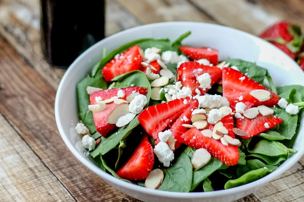 This easy recipe for Strawberry Spinach Salad with Goat Cheese is a delicious way to add more greens to your diet, plus it has protein and is gluten free! 