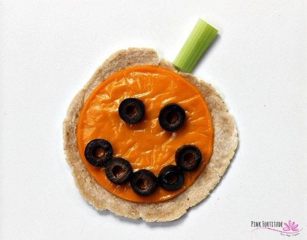 halloween pumpkin tortillas with olives and celery