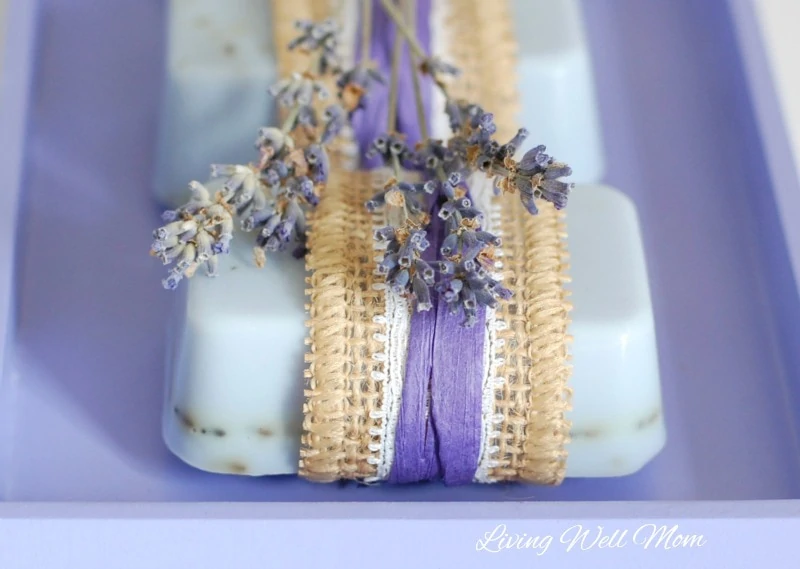 This homemade lavender goat milk soap recipe is easy to make (it takes less than an hour to make 12 bars!) and smells incredible with added essential oils. 