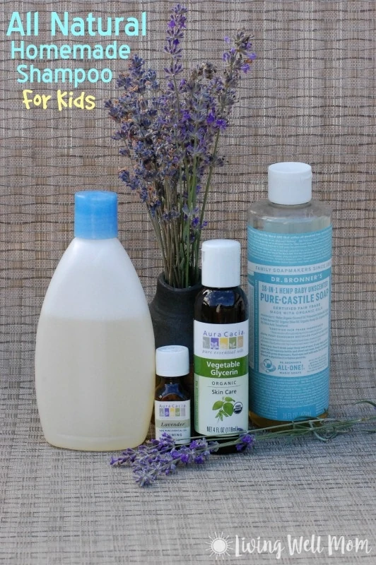 homemade shampoo for kids in plastic container with vase of lavender, essential oils, castile soap, and vegetable glycerin