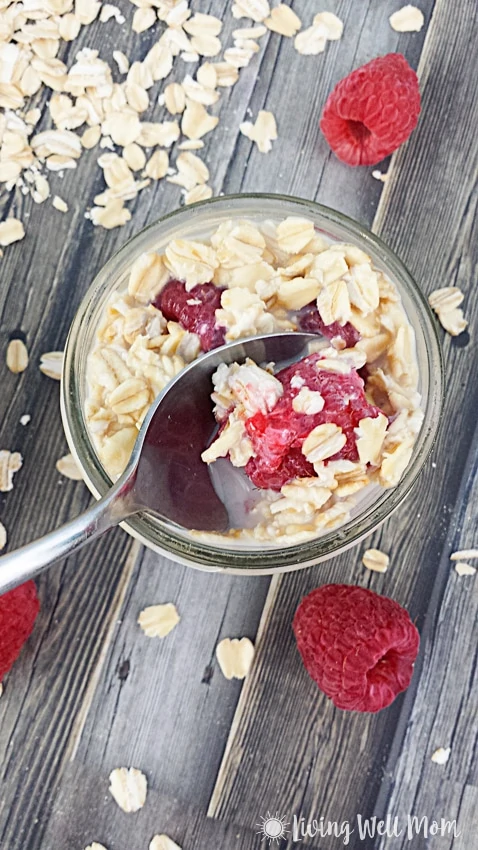 scooping up a bite of raspberry overnight oats 