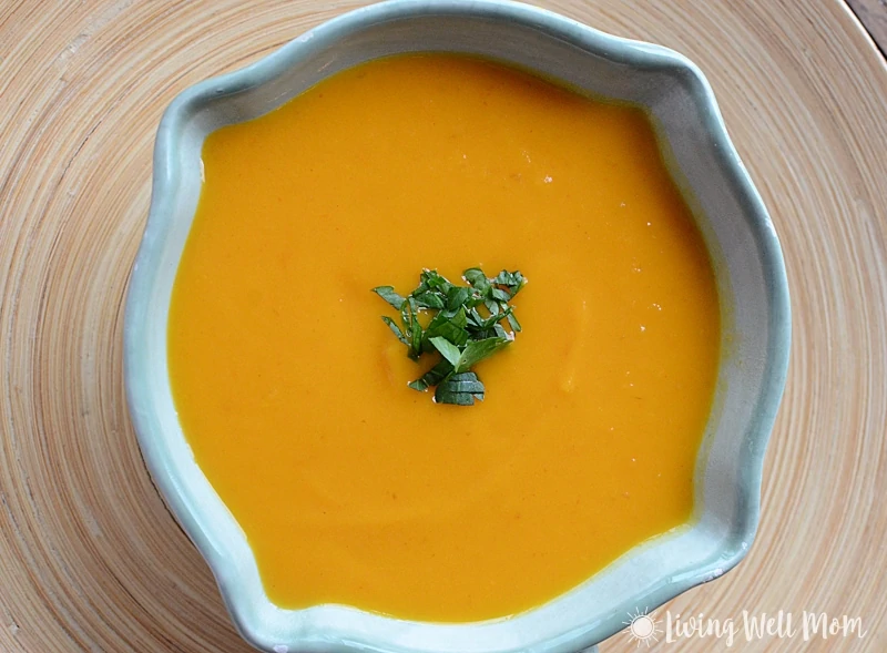 Thai Butternut Squash Soup is comfort food in a bowl without the guilt. You'll never guess this satisfying creamy fall soup is Paleo friendly and oh so easy to make!