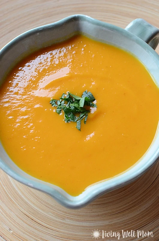 Thai Butternut Squash Soup is comfort food in a bowl without the guilt. You'll never guess this satisfying creamy fall soup is Paleo friendly and oh so easy to make!