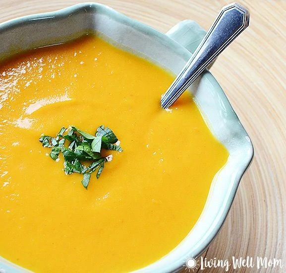 Thai Butternut Squash Soup is comfort food in a bowl without the guilt. You'll never guess this satisfying creamy fall soup is Paleo friendly and oh so easy to make!