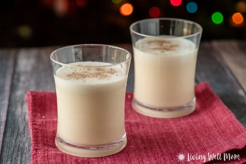 2 cups of eggnog in front of a christmas tree