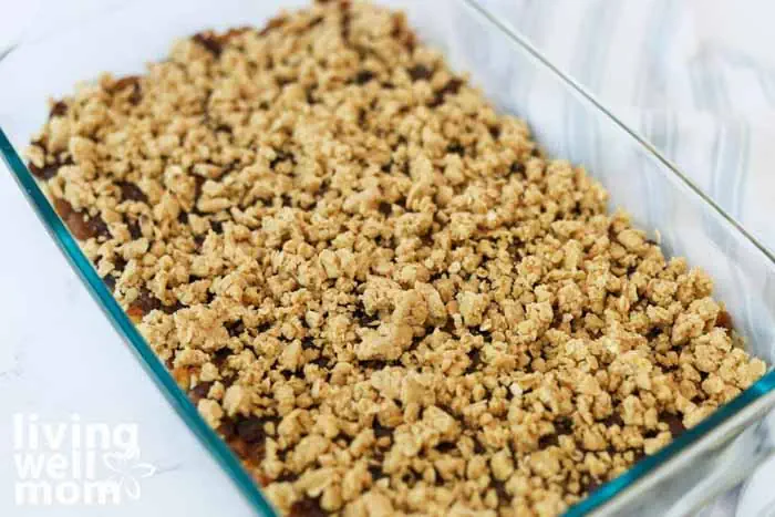 adding date mixture and crumbly topping to baking dish