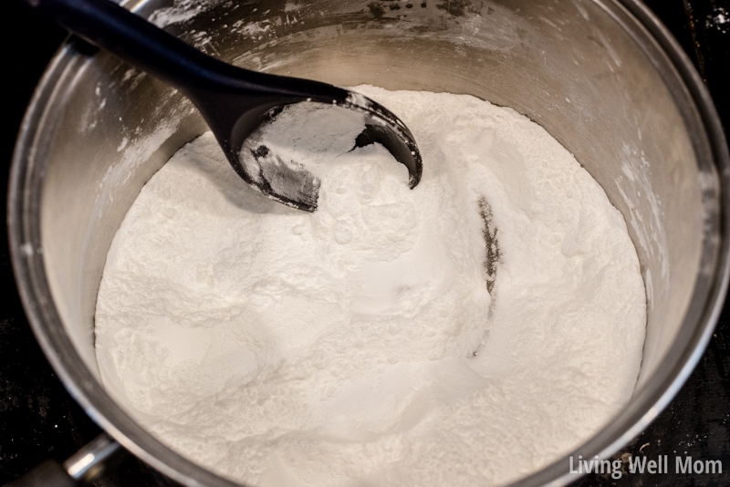 Baking soda and corn starch being mixed in a stainless steel pan