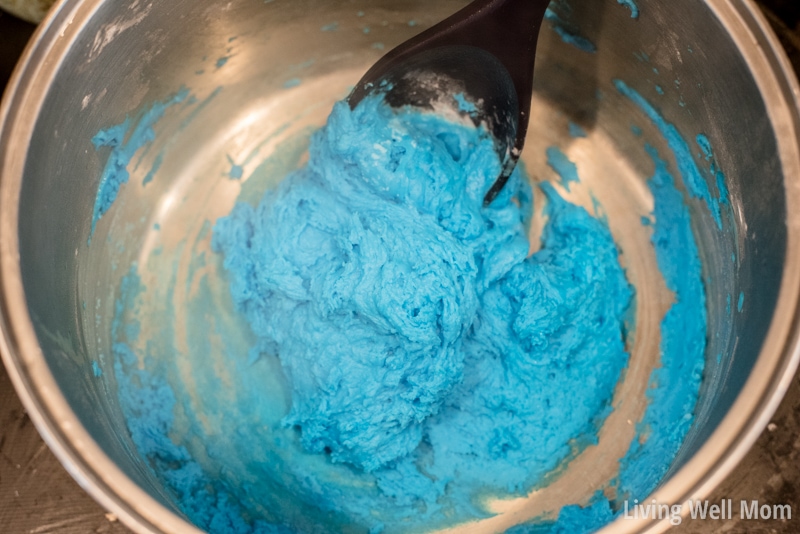 Homemade dough balling around a mixing spoon while being stirred on the stovetop