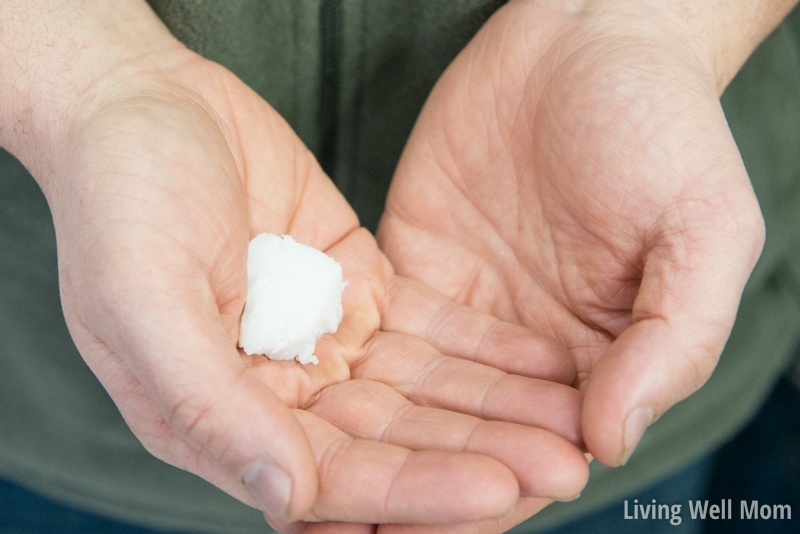 hands holding a spoonful of coconut oil