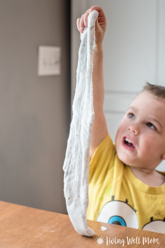 toddler with homemade glitter slime