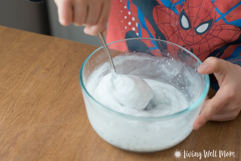 combining ingredients for homemade glitter slime