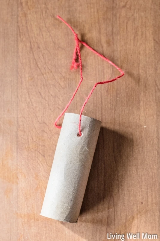 Looking for an easy activity to do with the kids? This simple homemade bird feeder uses common household items you probably already have and is so easy to make, it's the perfect project for young children! Plus it's a great way to teach kids about nature; they'll love seeing wild birds eat from their very own feeder!