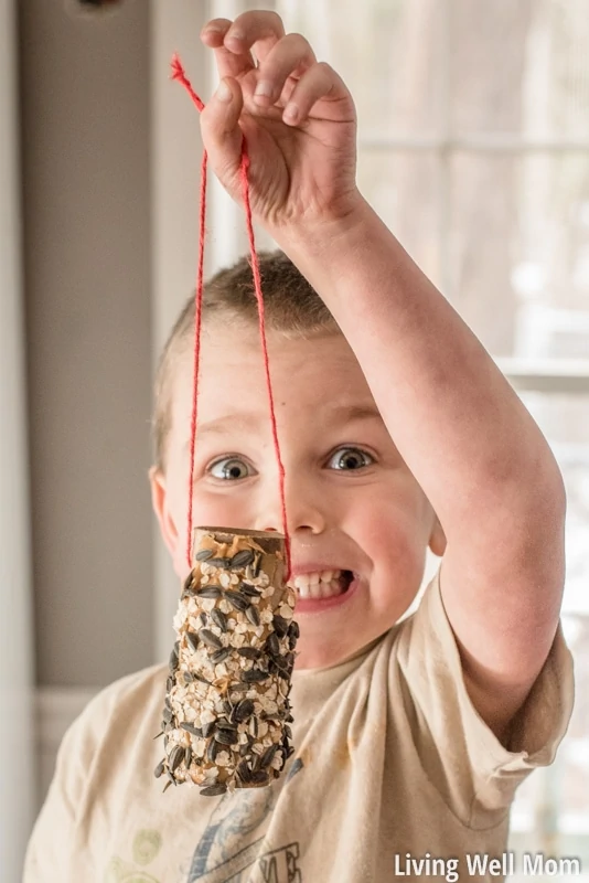 Looking for an easy activity to do with the kids? This simple homemade bird feeder uses common household items you probably already have and is so easy to make, it's the perfect project for young children! Plus it's a great way to teach kids about nature; they'll love seeing wild birds eat from their very own feeder!