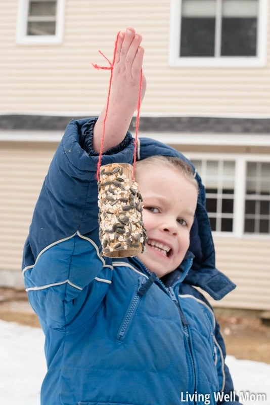 Looking for an easy activity to do with the kids? This simple homemade bird feeder uses common household items you probably already have and is so easy to make, it's the perfect project for young children! Plus it's a great way to teach kids about nature; they'll love seeing wild birds eat from their very own feeder!