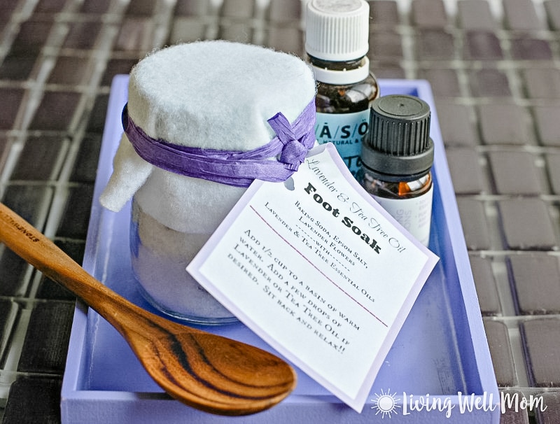 homemade lavender foot soak with label in purple tray with essential oils