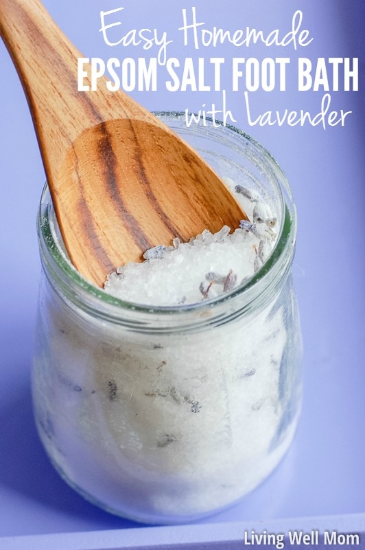 homemade lavender epsom salt foot bath in glass jar with wood spoon and purple background