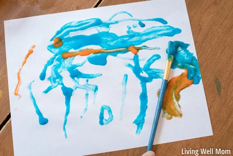 blue paint smeared all over white paper