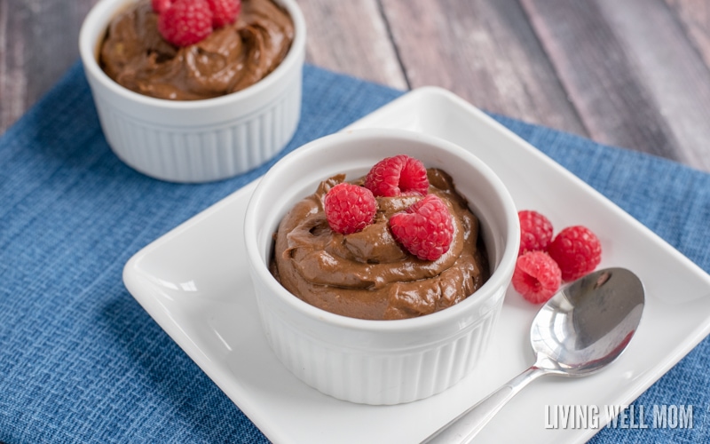 avocado chocolate mousse in a white ramekin topped with raspberries