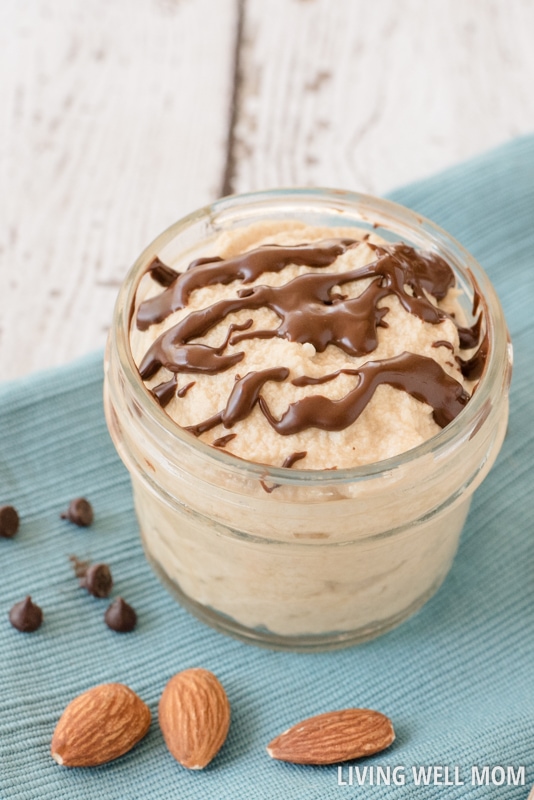 a mason jar with almond butter dessert drizzled in chocolate