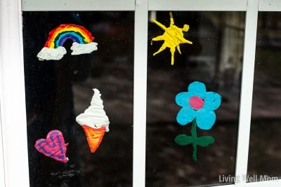homemade colorful window clings with rainbow, sun, flower, ice cream designs