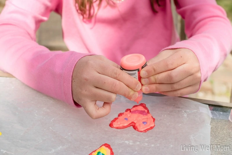 Why buy them when you can make them? This is the easiest way to make DIY Window Clings! Super easy, fun, and creative - kids of all ages will love making their very own window art! Find out how to do it here...