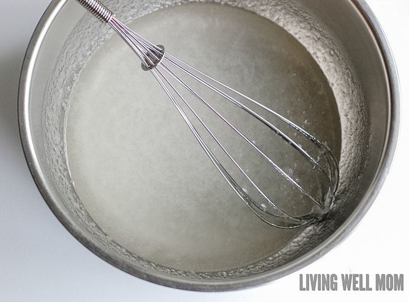 a whisk getting ready to stir ingredients for DIY sunburn relief cream