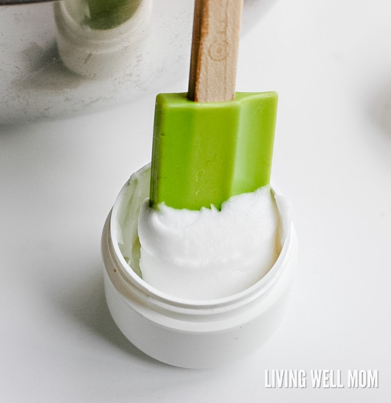 rubber spatula scooping up homemade sunburn relief cream