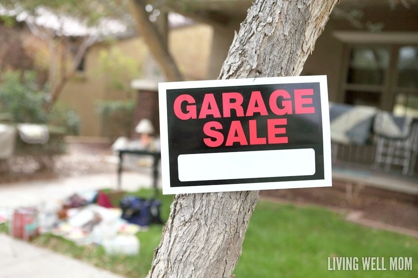 A Garage Sale Sign On A Tree