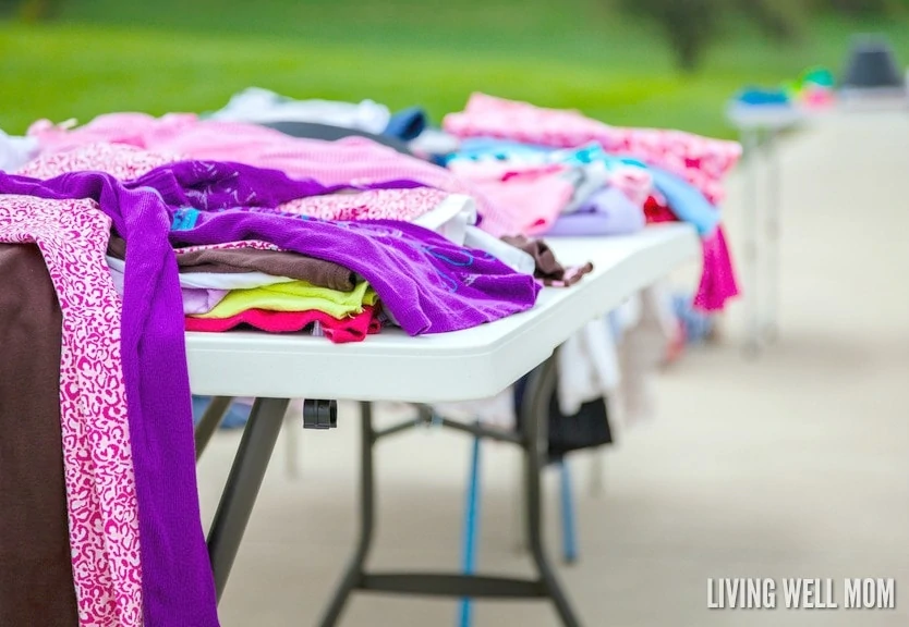 clothes on a folding table at a yard sale