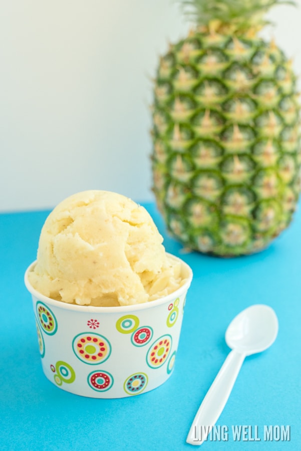 dole whip in a cup with a pineapple in the background