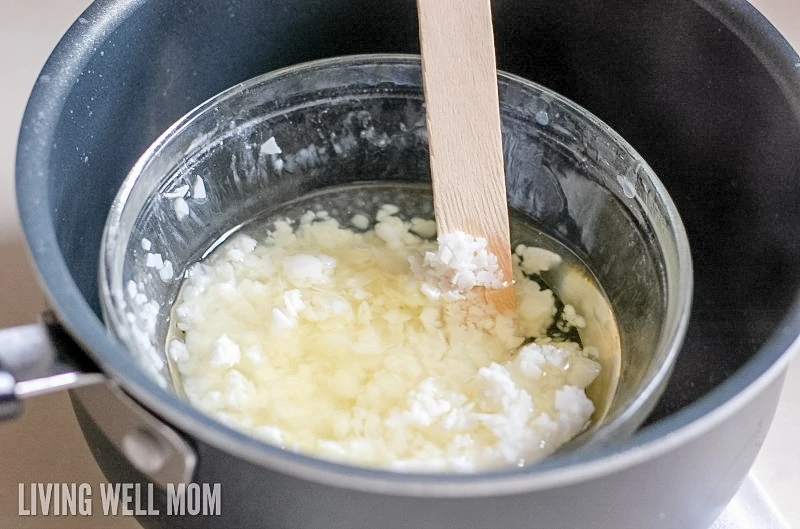 melting soy wax in a bowl inside of a sauce pan of water