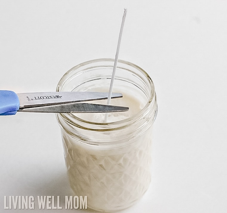 trimming a wick with scissors