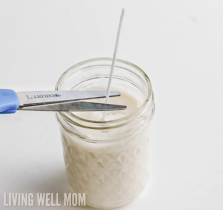 trimming a wick with scissors