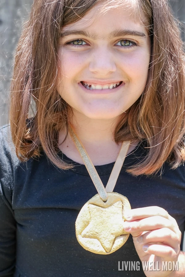 Celebrate the Olympics by making fun DIY Salt Dough Olympic Medals with your kids! They’re a fun craft for children of all ages and they’ll love wearing their very own gold medals as you watch favorite athletes compete! 
