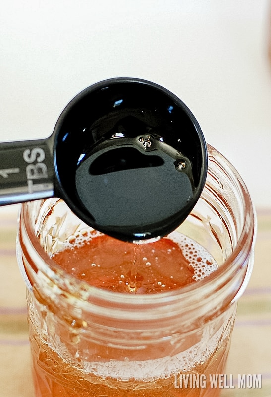 adding face cleanser ingredients to a mason jar